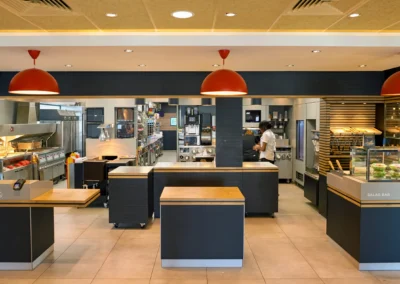 McDonald's French fries, burgers and drinks on table indoors