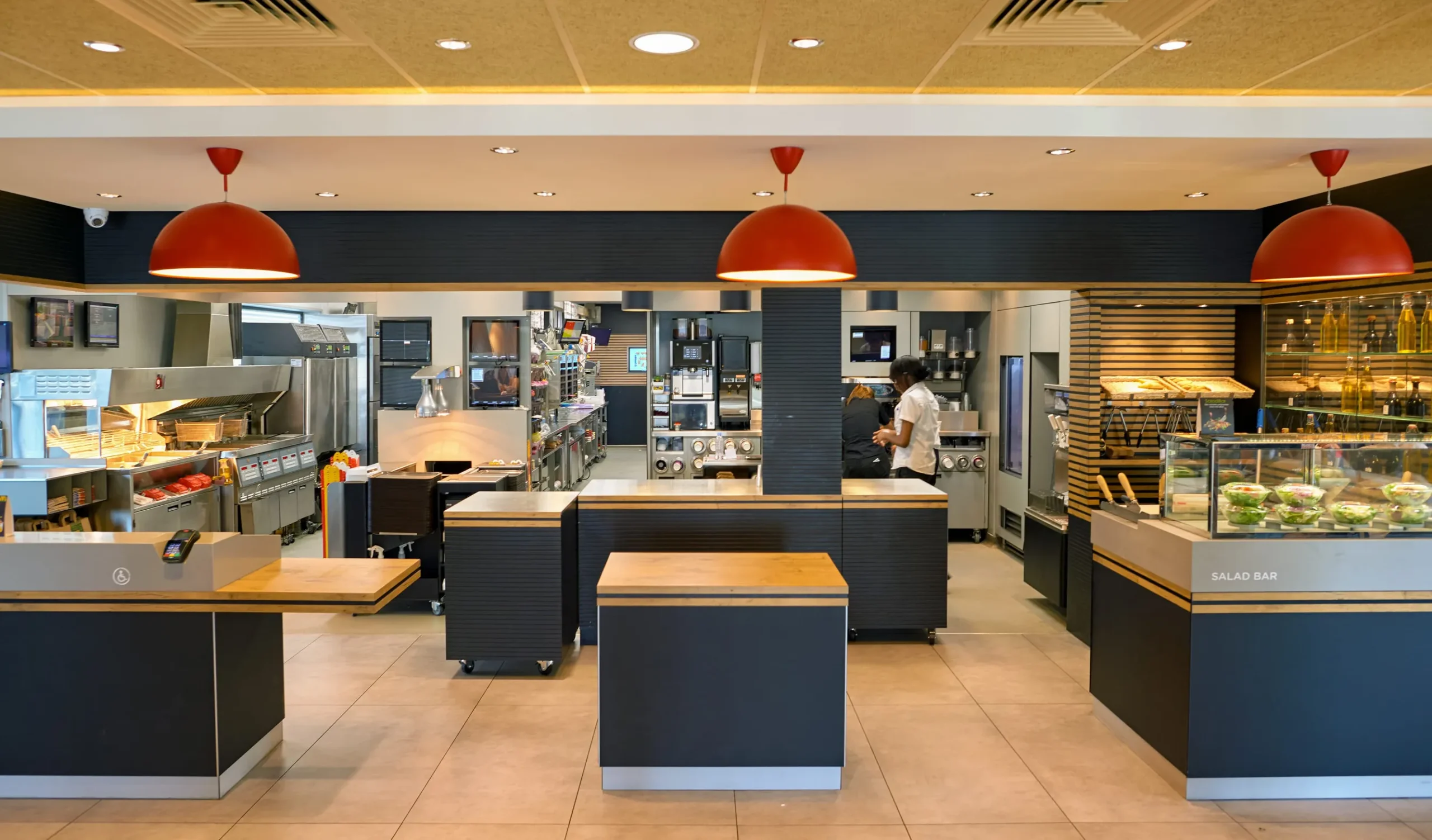 McDonald's interior McDonald's French fries, burgers and drinks on table indoors