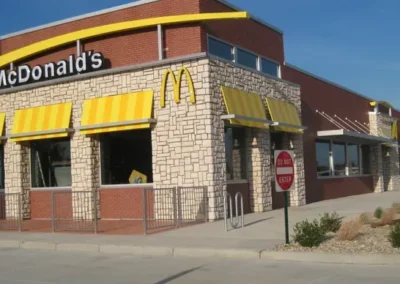 The modern exterior of a McDonald's restaurant building on a clear day