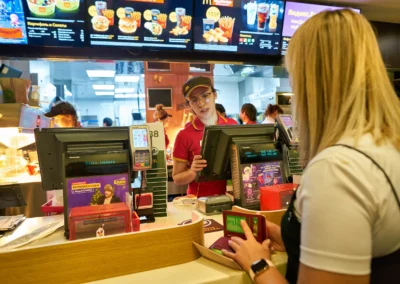 taff taking an order from woman at McDonald's restaurant in Moscow